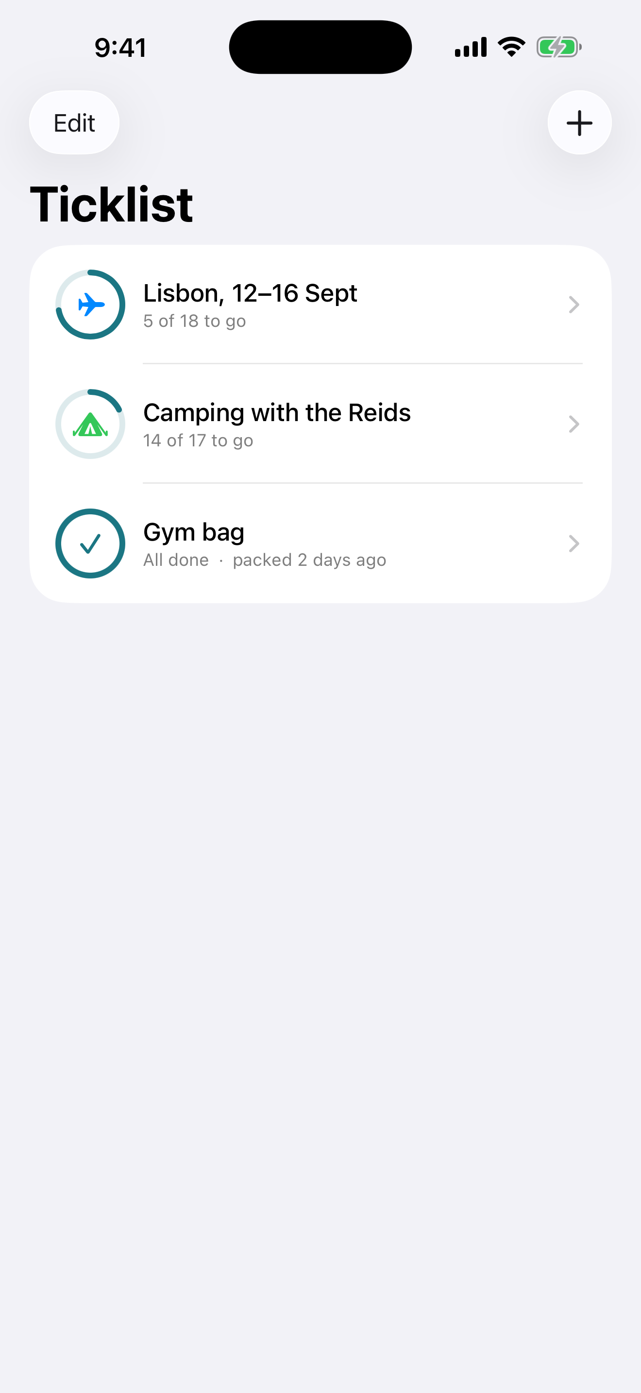 The Ticklist home screen showing three lists: Lisbon 12 to 16 September with five of eighteen to go, Camping with the Reids with fourteen of seventeen to go, and Gym bag marked all done and packed two days ago. Each has its progress drawn around its icon.