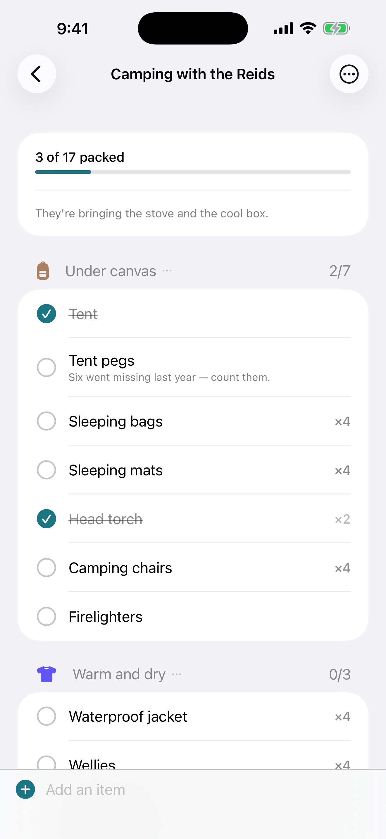 A camping list with hand-written headings: Under canvas holding the tent, pegs, sleeping bags and camping chairs, and Warm and dry below it.