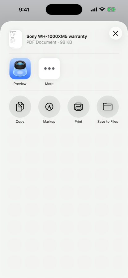 The iOS share sheet showing a file called Sony WH-1000XM5 warranty, a PDF document of 98 kilobytes, with options to preview, copy, mark up, print or save to Files.